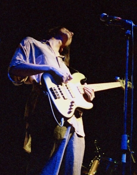Mariano Alvarez playing bass on stage
